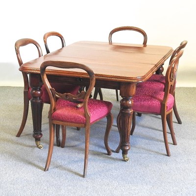 Lot 473 - A dining table and chairs