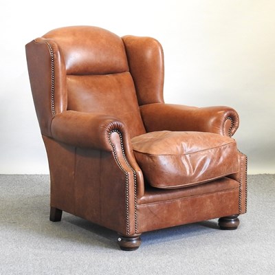 Lot 15 - A leather armchair