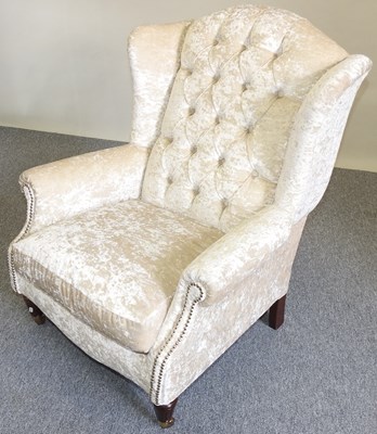 Lot 20 - An upholstered armchair