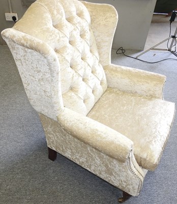 Lot 20 - An upholstered armchair