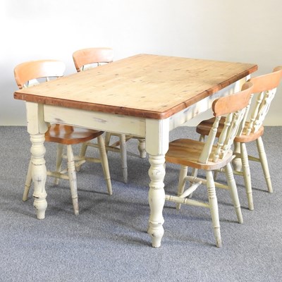 Lot 416 - A dining table and chairs