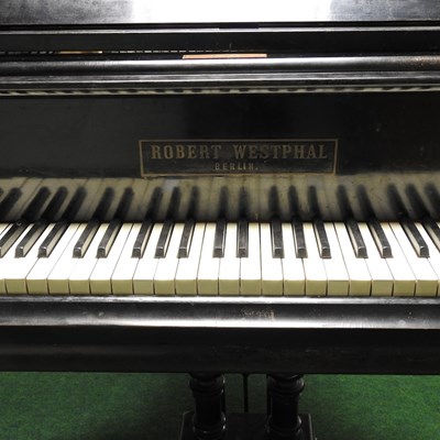Lot 505 - A baby grand piano