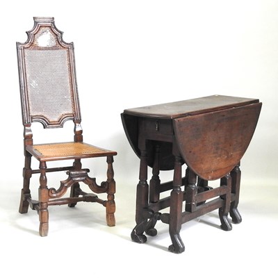 Lot 176 - An oak table and chair