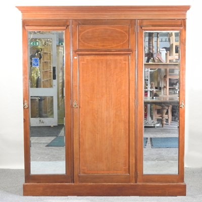 Lot 512 - An Edwardian mahogany triple wardrobe