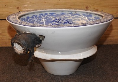 Lot 119 - A 19th century Staffordshire pottery blue and white toilet bowl