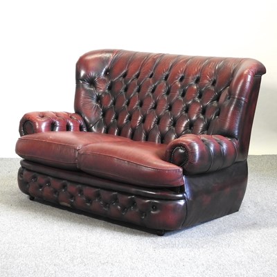 Lot 515 - A Thomas Lloyd red leather sofa