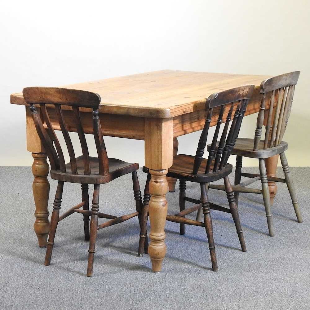 Lot 68 - A pine table and chairs