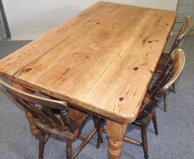 Lot 68 - A pine table and chairs