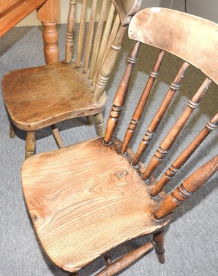 Lot 68 - A pine table and chairs