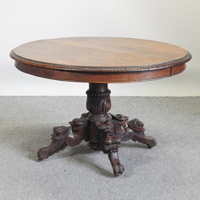 Lot 516 - A Victorian carved oak centre table