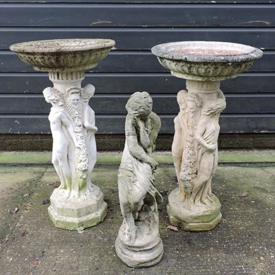 Lot 323 - A near pair of reconstituted stone bird baths