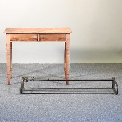 Lot 373 - A pine table and rack