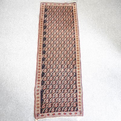 Lot 585 - A Persian runner