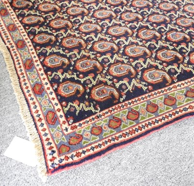 Lot 585 - A Persian runner