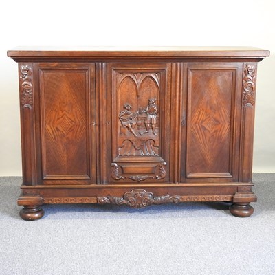 Lot 440 - An oak cabinet