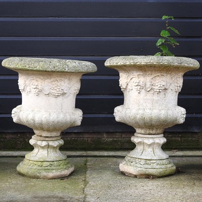 Lot 69 - A pair of garden urns