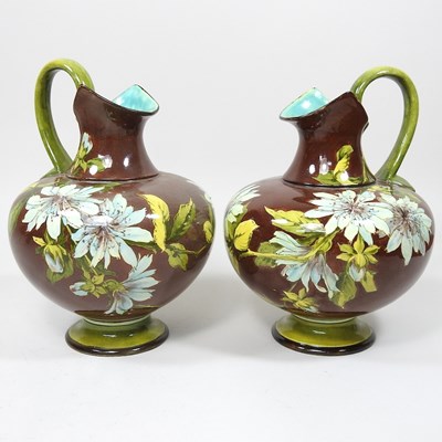 Lot 145 - A pair of Doulton ewers