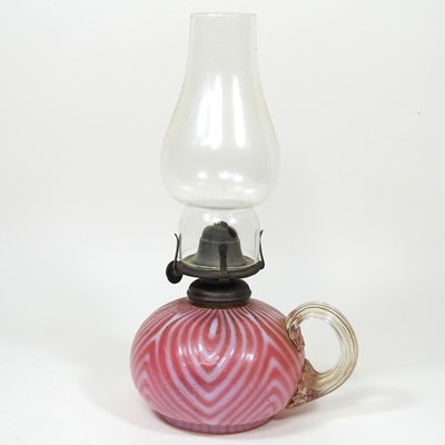 Lot 28 - A glass finger lamp