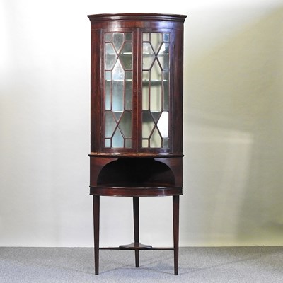 Lot 354 - A corner cabinet