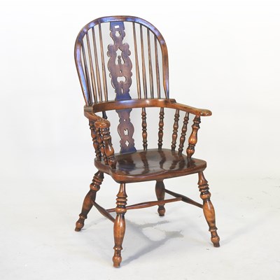 Lot 596 - A 19th century elm seated Windsor armchair