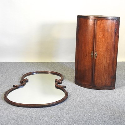 Lot 607 - A mirror and a cabinet