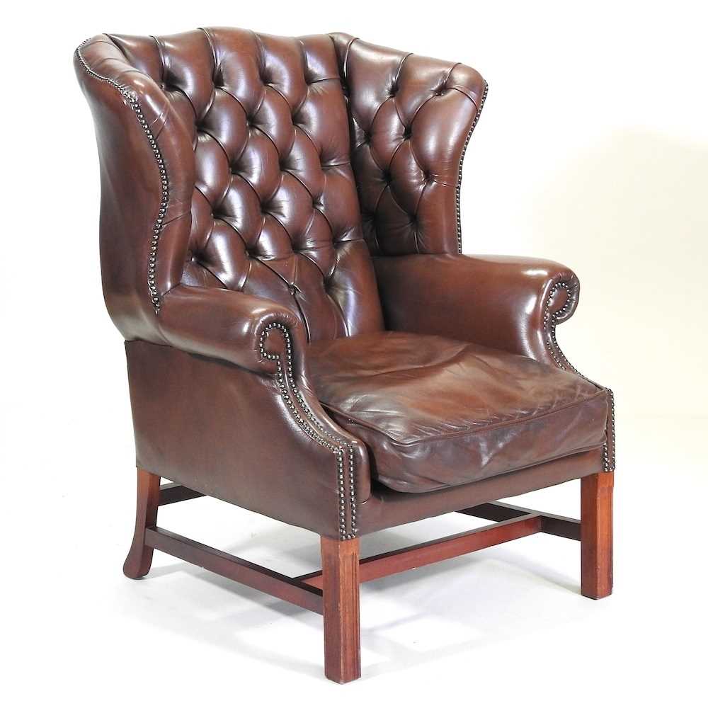 Lot 331 - A wing armchair