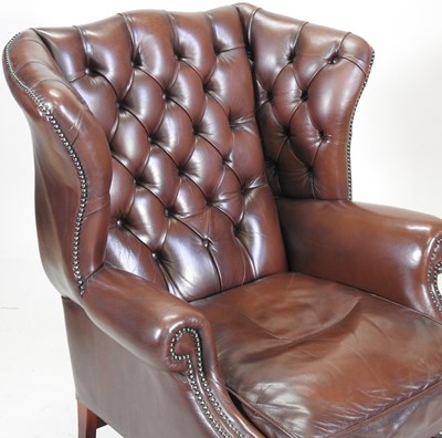 Lot 331 - A wing armchair