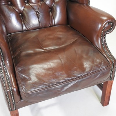 Lot 331 - A wing armchair