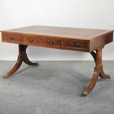 Lot 547 - A Regency style yew wood writing table