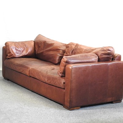 Lot 681 - A brown leather upholstered sofa