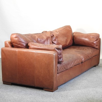 Lot 683 - A brown leather upholstered sofa