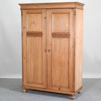 Lot 475 - An antique pine double wardrobe