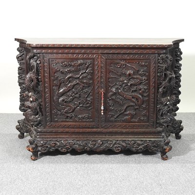 Lot 67 - A Chinese carved cabinet
