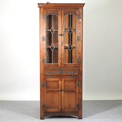 Lot 226 - A corner cabinet