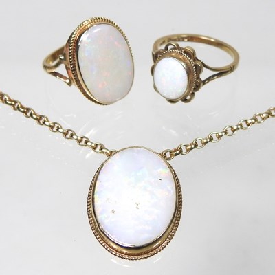 Lot 68 - Two opal rings and a brooch