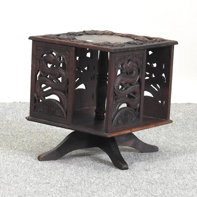 Lot 299 - An early 20th century Chinese carved revolving table top bookcase