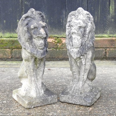 Lot 319 - A pair of reconstituted stone garden models of lions