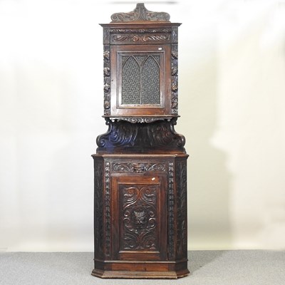 Lot 418 - A Victorian carved oak corner cabinet