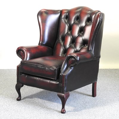 Lot 28 - A brown armchair