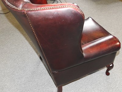 Lot 28 - A brown armchair