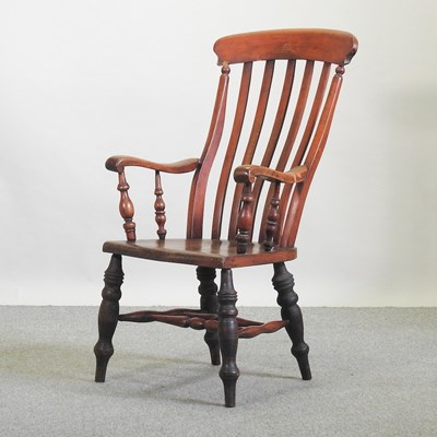 Lot 575 - An early 20th century Windsor style armchair