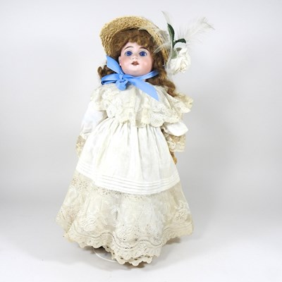 Lot 370 - A bisque head doll