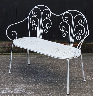 Lot 331 - A white painted metal garden bench