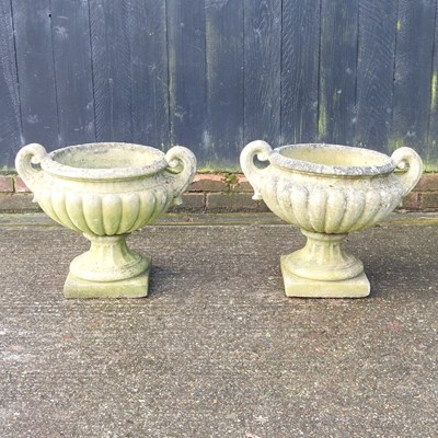 Lot 344 - A pair of reconstituted stone garden planters