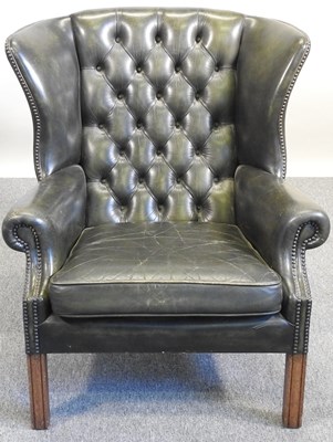 Lot 3 - A wing armchair