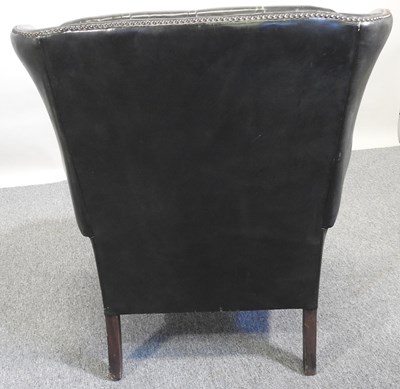 Lot 3 - A wing armchair