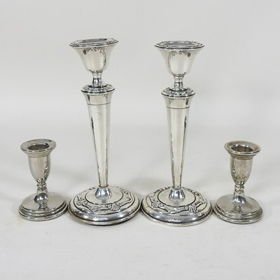 Lot 46 - Two pairs of candlesticks