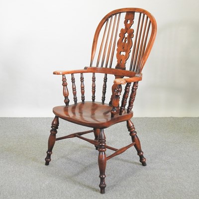 Lot 551 - A 19th century style elm seated windsor style armchair