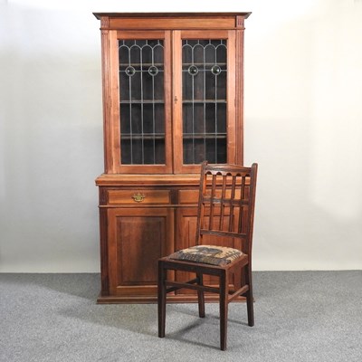 Lot 196 - An Edwardian walnut cabinet bookcase