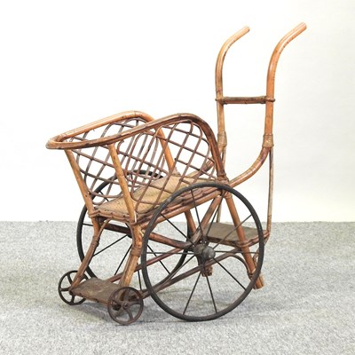 Lot 407 - An early 20th century bamboo and wicker children's toy cart